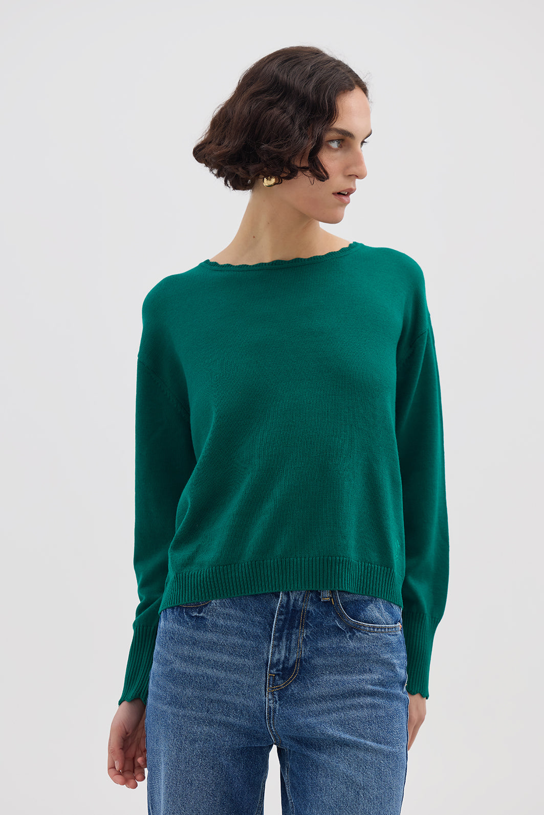 Model wearing the Emerald Core Merino Wool Sweater – elegant ladies wool jumper with subtle logo embroidery