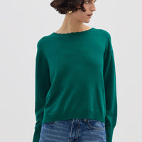 Model wearing the Emerald Core Merino Wool Sweater – elegant ladies wool jumper with subtle logo embroidery