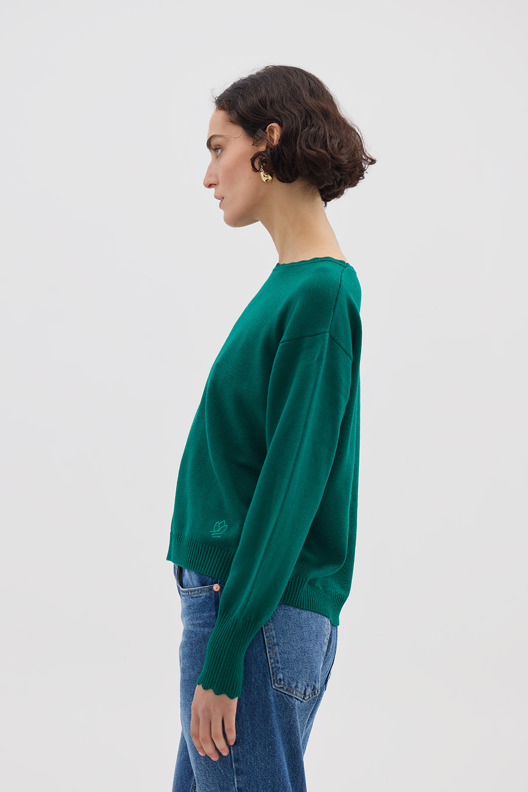 Side view of model in Emerald Wool Sweater – warm, lightweight, and effortlessly stylish