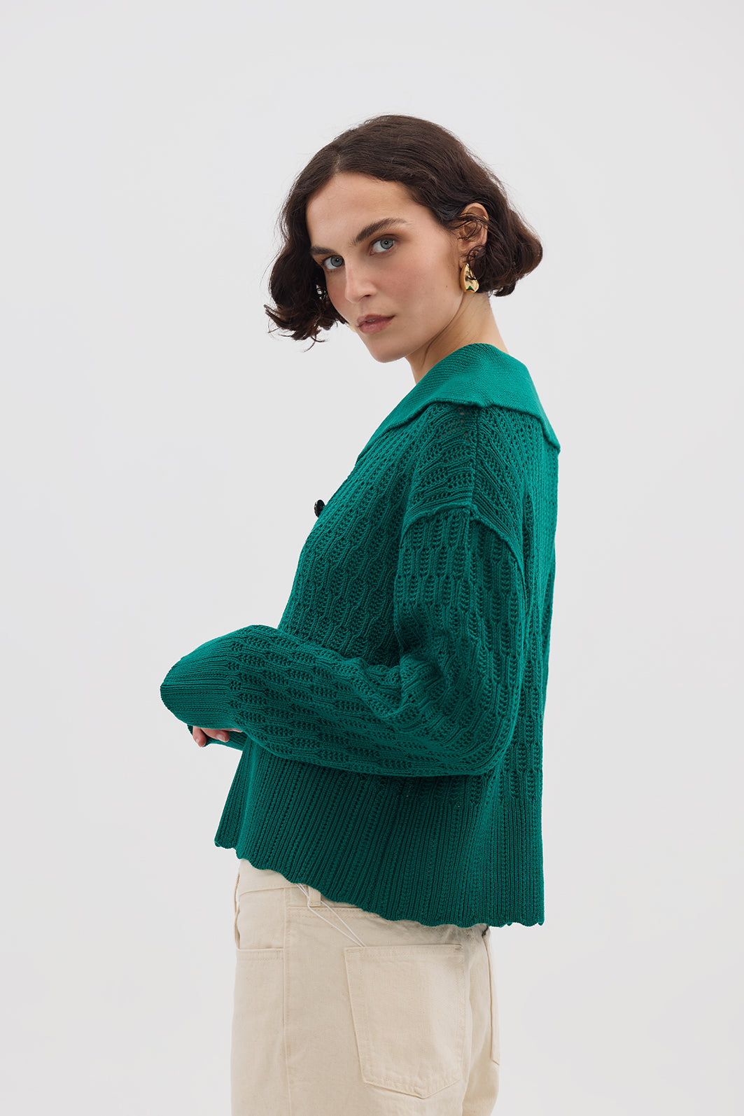 Side profile of model in Emerald Wool Sweater – warm, stylish, and cozy knitwear