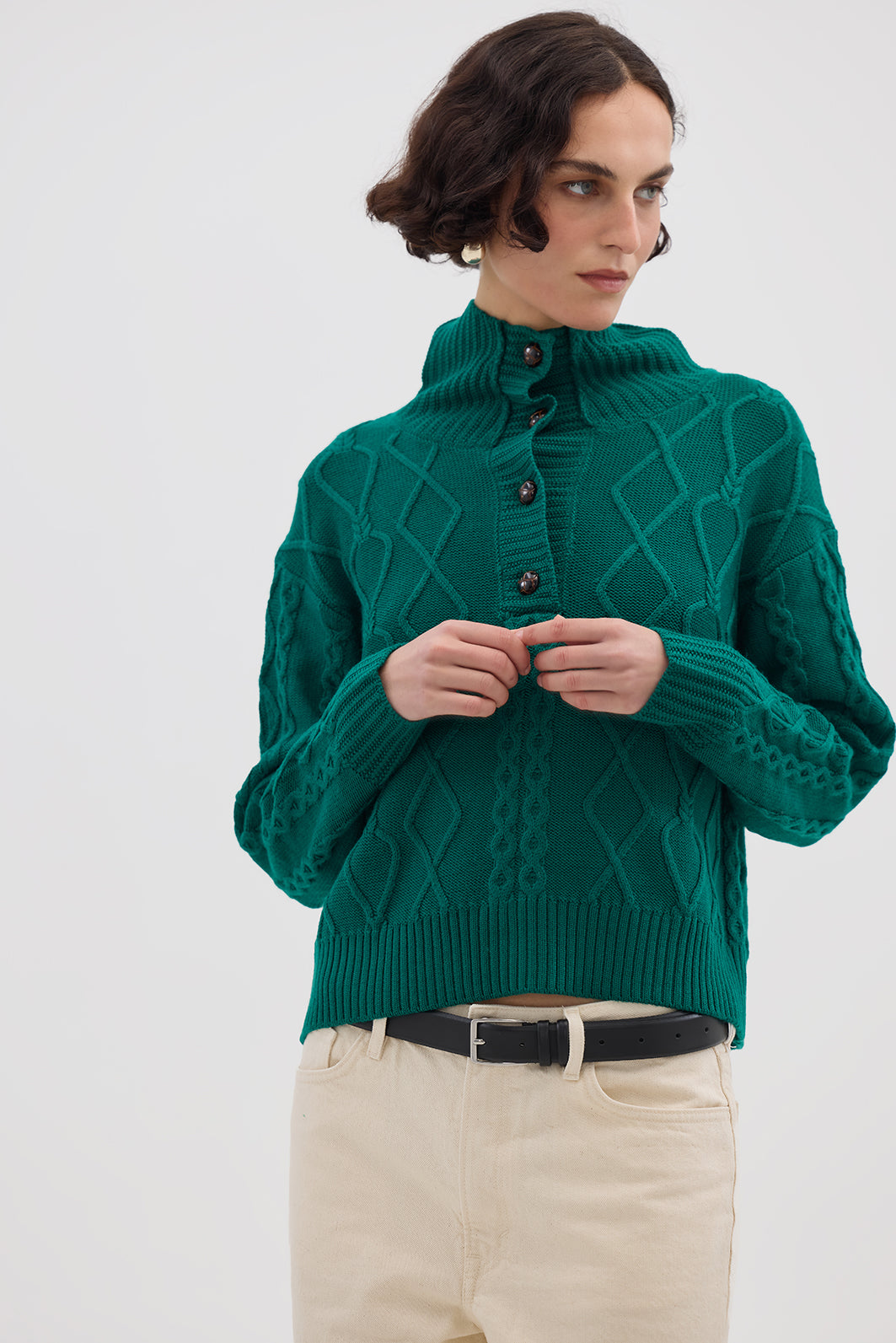 Model wearing the Emerald Cable Heart Button Neck Merino Sweater – luxurious and stylish ladies wool sweater