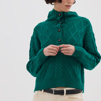 Model wearing the Emerald Cable Heart Button Neck Merino Sweater – luxurious and stylish ladies wool sweater