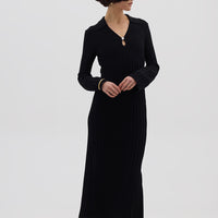 Model wearing the Black Engineered Rib Polo Wool Dress – refined and breathable Merino dress