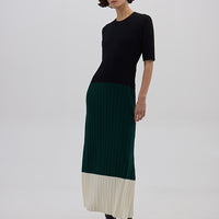 Model wearing the Black & Emerald Colour Block Wool Dress – sophisticated and breathable Merino dress