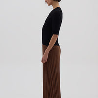 Side profile of model in Black & Walnut Merino Dress – soft, structured, and effortlessly chic