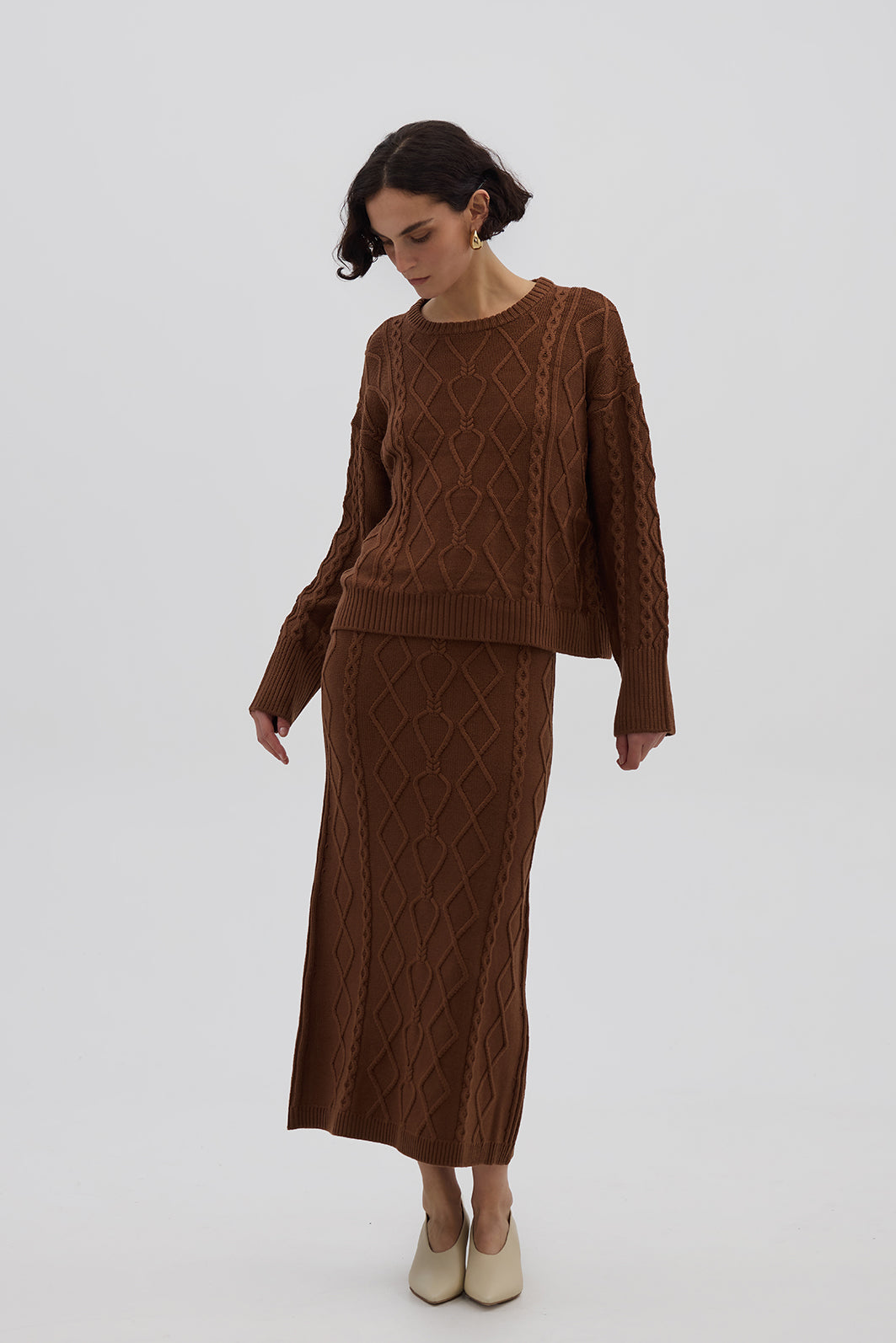 Model wearing the Brown Cable Heart Merino Sweater – cozy ladies wool sweater with diamond cable-knit pattern