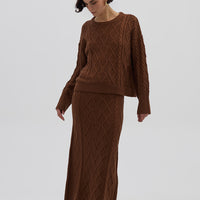 Model wearing the Brown Cable Heart Merino Sweater – cozy ladies wool sweater with diamond cable-knit pattern