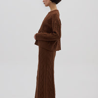 Side profile of model in Brown Cable Knit Sweater – warm and effortlessly stylish knitwear