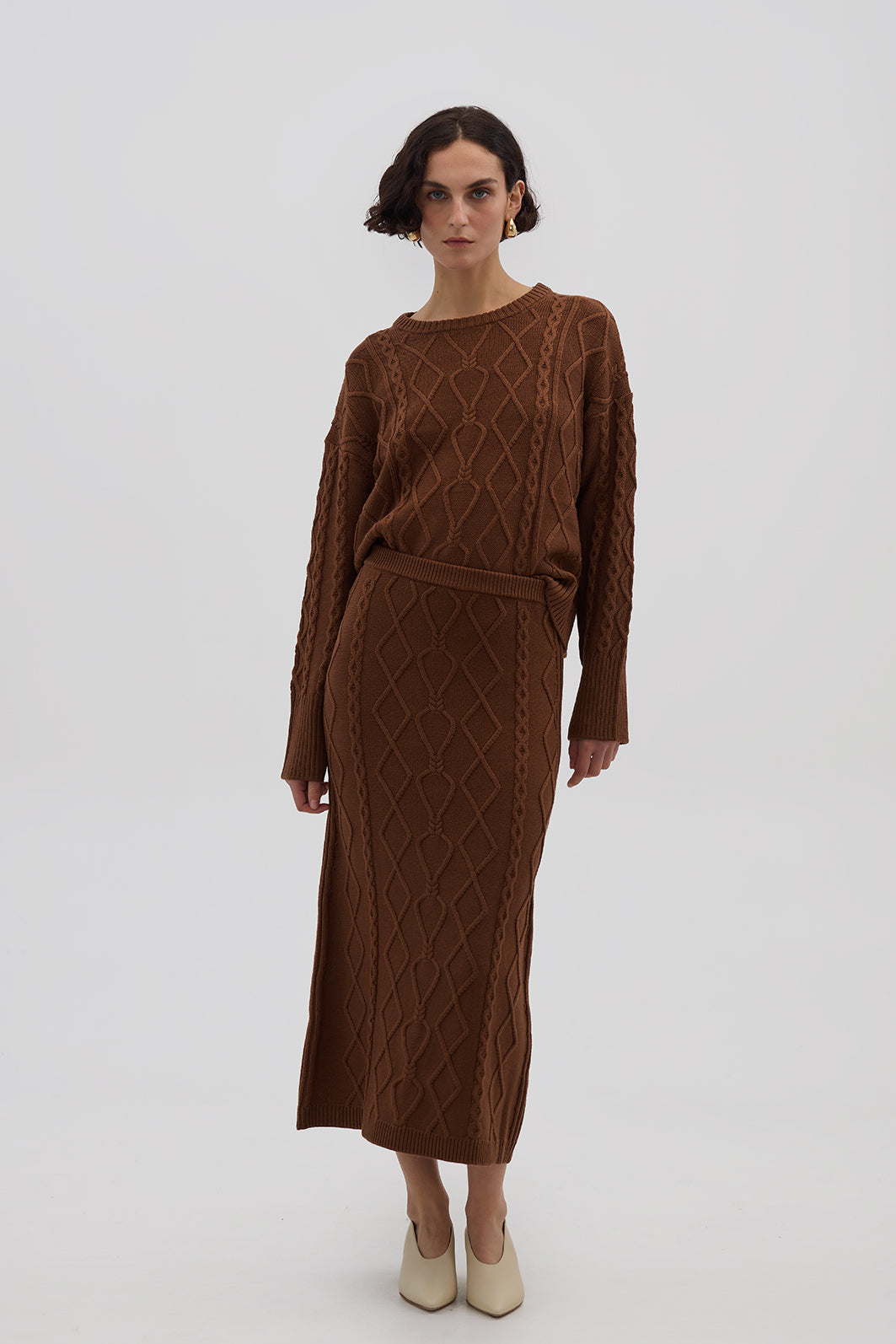 Model wearing the Brown Heart Cable Maxi Wool Skirt – soft and structured knit skirt