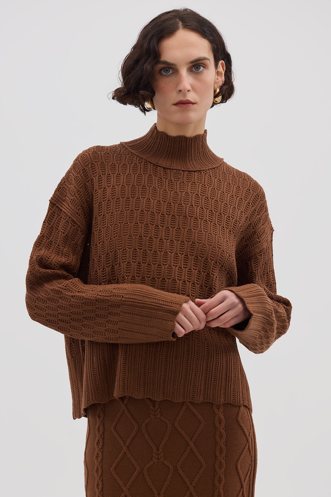 Model wearing the Brown Corded Rib High Neck Merino Sweater – warm and stylish ladies wool jumper