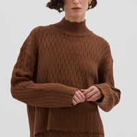 Model wearing the Brown Corded Rib High Neck Merino Sweater – warm and stylish ladies wool jumper