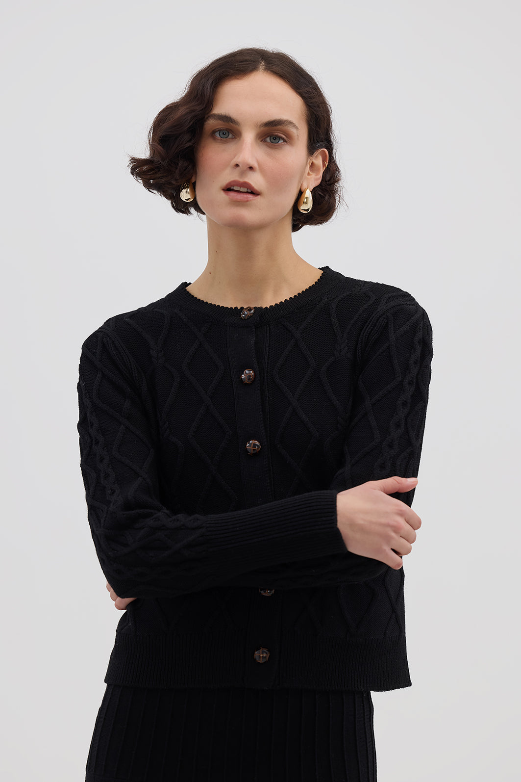 Model wearing the Black Heart Cable Wool Cardigan – elegant ladies wool cardigan in a deep black shade