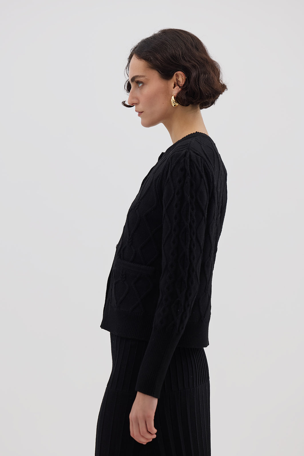 Side view of model in Black Wool Cardigan – timeless and effortlessly chic winter knit