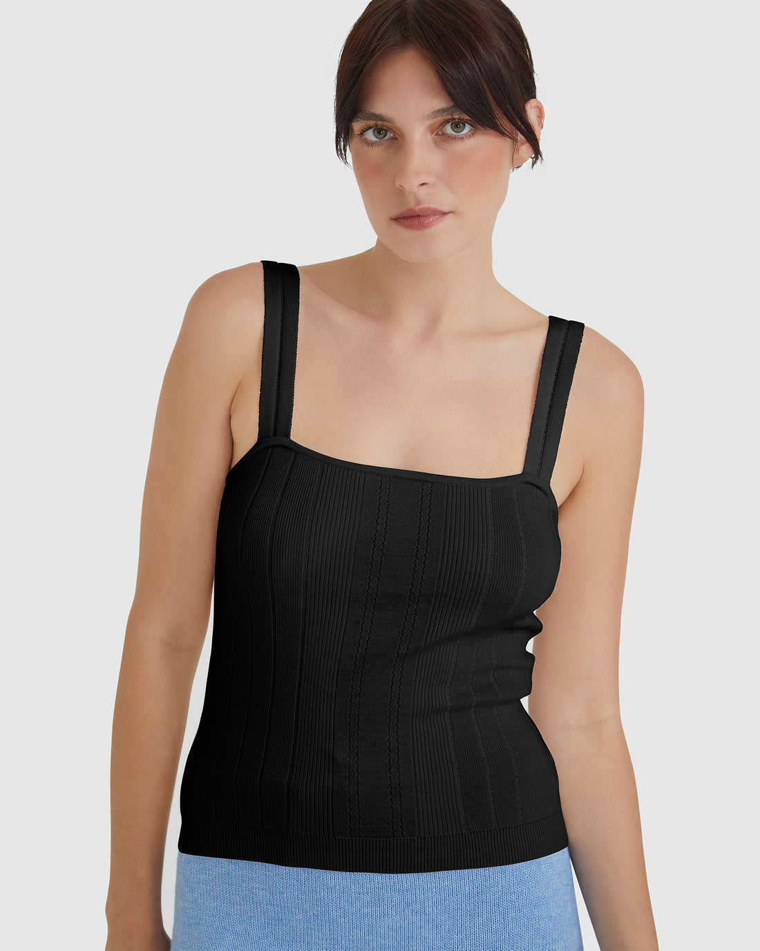 Black Isla ribbed cami top with elegant pointelle strap detail.