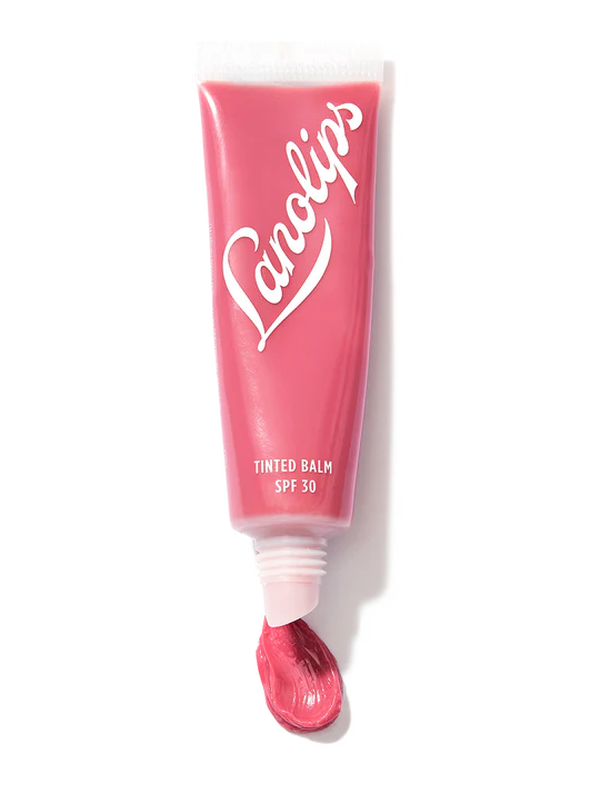 Lanolips Tinted Lanolin Lip Balm in Rhubarb tube on display.