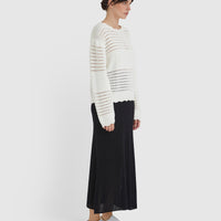 Elegant crochet top styled with ribbed panels, ideal for summer and transitional wear.