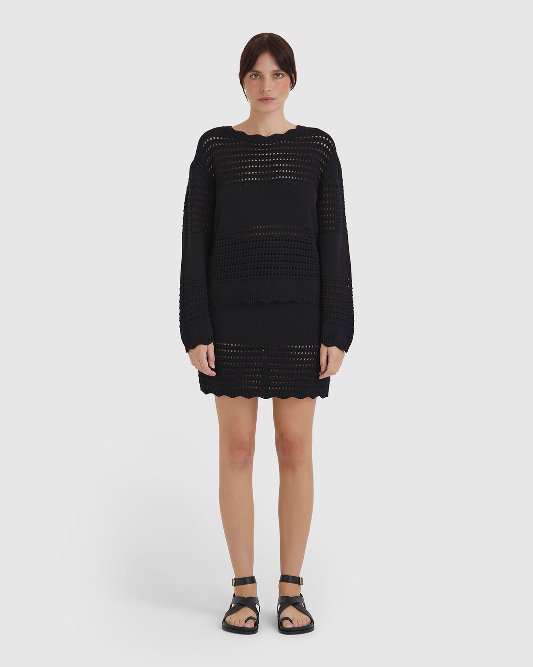 Black Margot Crochet Sweater with crochet and ribbed detailing.