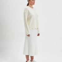 Classic cream womens knit sweater featuring scalloped edges and warm wool fabric.