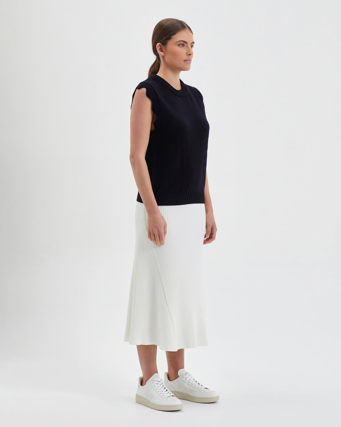 Flattering black ladies knit vest with a timeless design, crafted from merino wool.