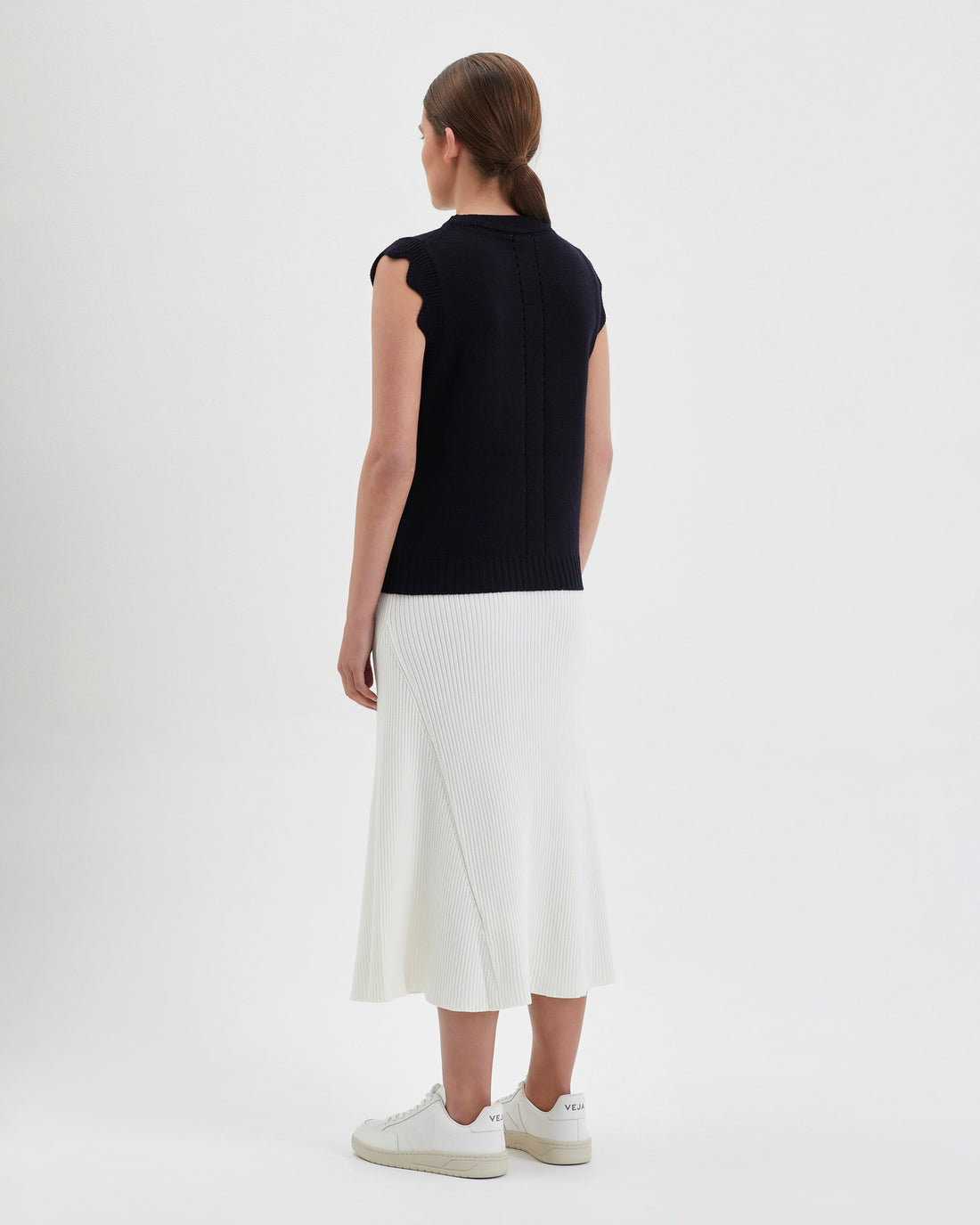Classic black wool vest with subtle stitching, perfect for versatile layering.