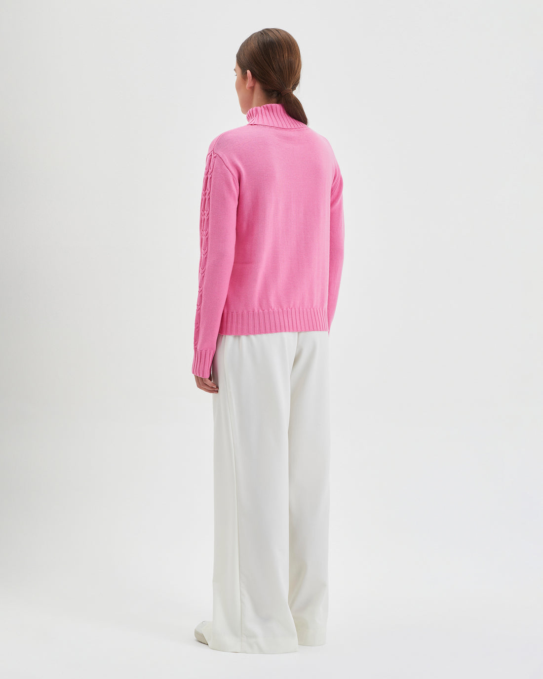 Merino wool cable knit sweater in candy for winter warmth