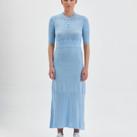 Seafoam Pointelle Knit Dress with fitted corset-style bodice and pleated skirt.