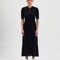 Black Pointelle Knit Dress with corset-inspired bodice and pleated skirt.