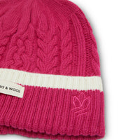 Peony merino wool beanie with plaited texture, ideal for winter warmth.