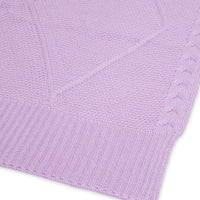 Close-up of Iris merino wool scarf with intricate cable pattern.