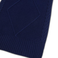 Close-up of Navy merino wool scarf, highlighting cable texture.