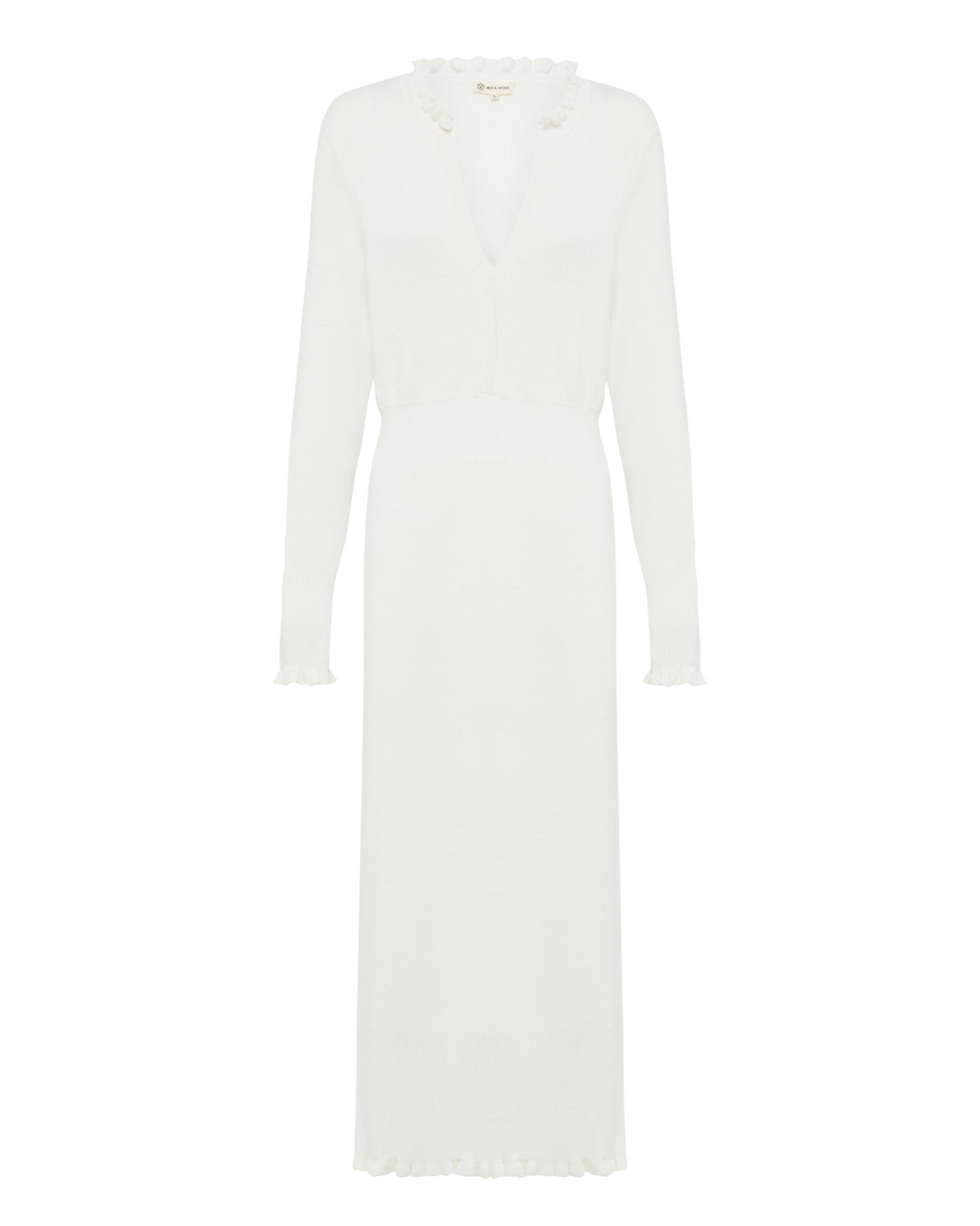 a classic fitted, long-sleeve ivory wool knit dress with intricate ruffle details.