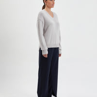 Women’s knit sweater in Merino wool, perfect for winter warmth and style.