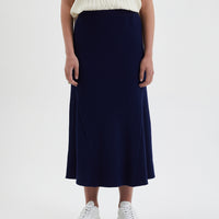 Wool skirt in navy with flattering A-line silhouette and soft knit texture.