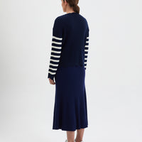 Elegant navy wool sweater with scallop edges and classic stripes.