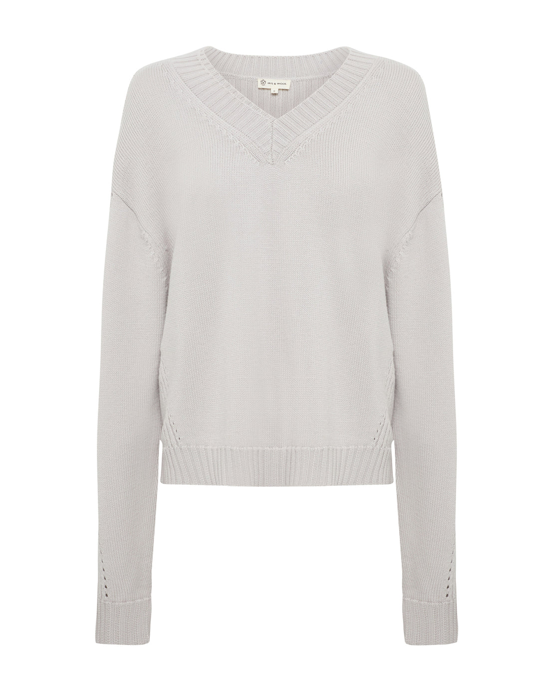Close-up of pointelle detailing on cozy Merino jumper for sophisticated layering.