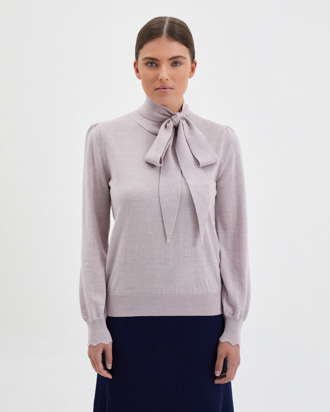 Close-up of rose melange Jacqueline Bow Sweater in 100% Merino wool.