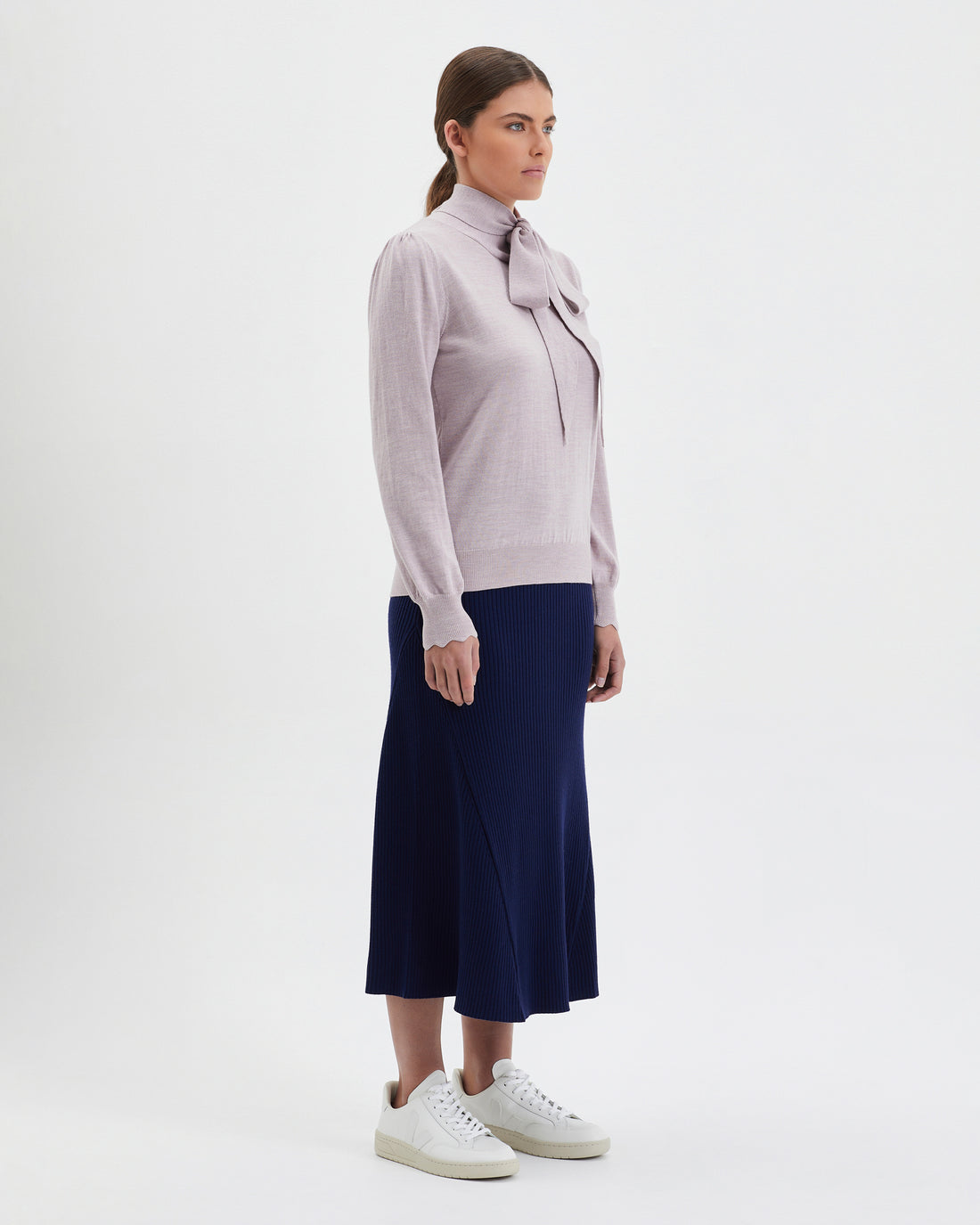 Elegant rose melange wool sweater with bow detail, perfect for day-to-night style.