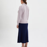 Jacqueline Bow Sweater in rose melange, crafted from soft Merino wool for versatile wear.