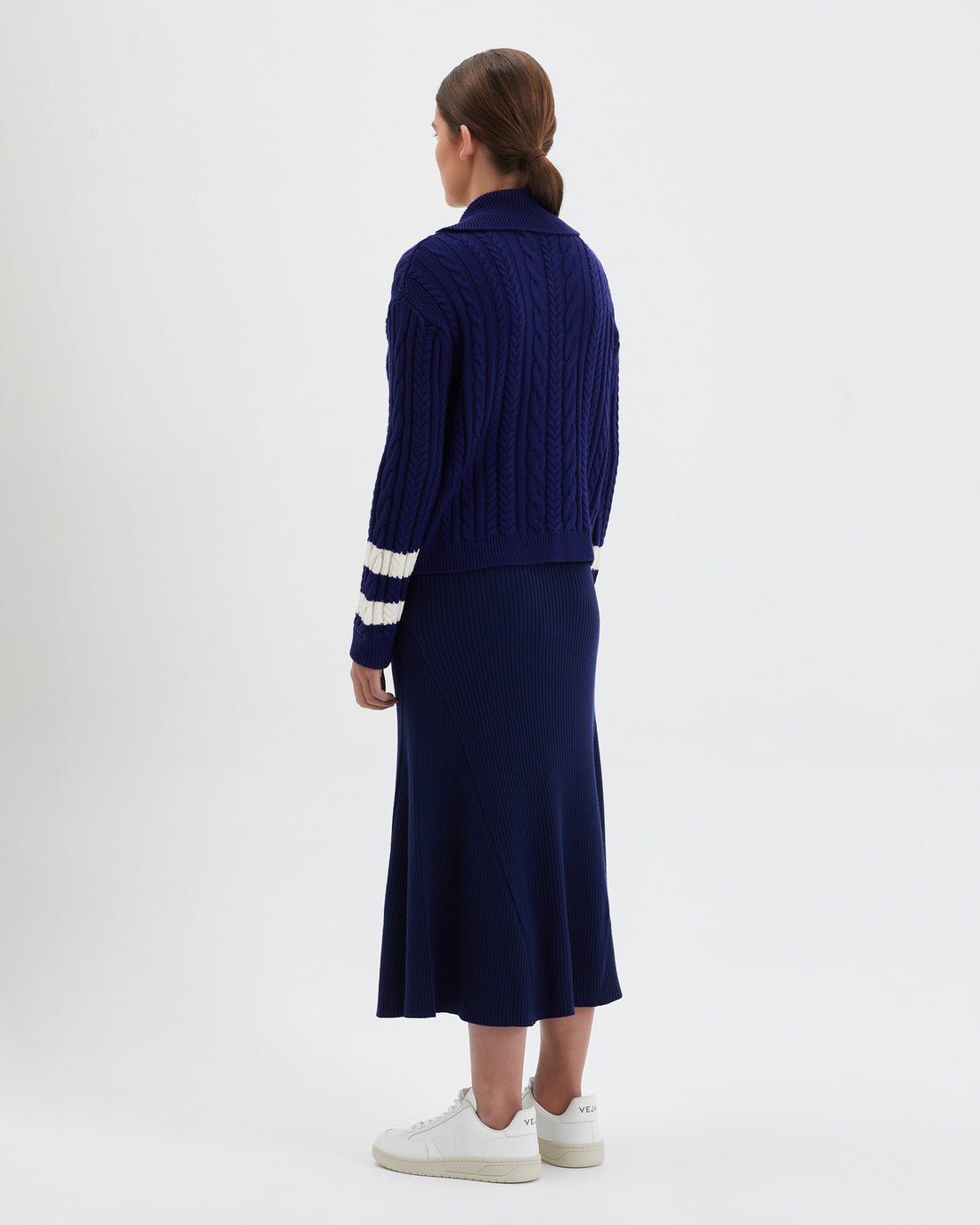 Back view of the petrisse Navy cardigan in Merino wool