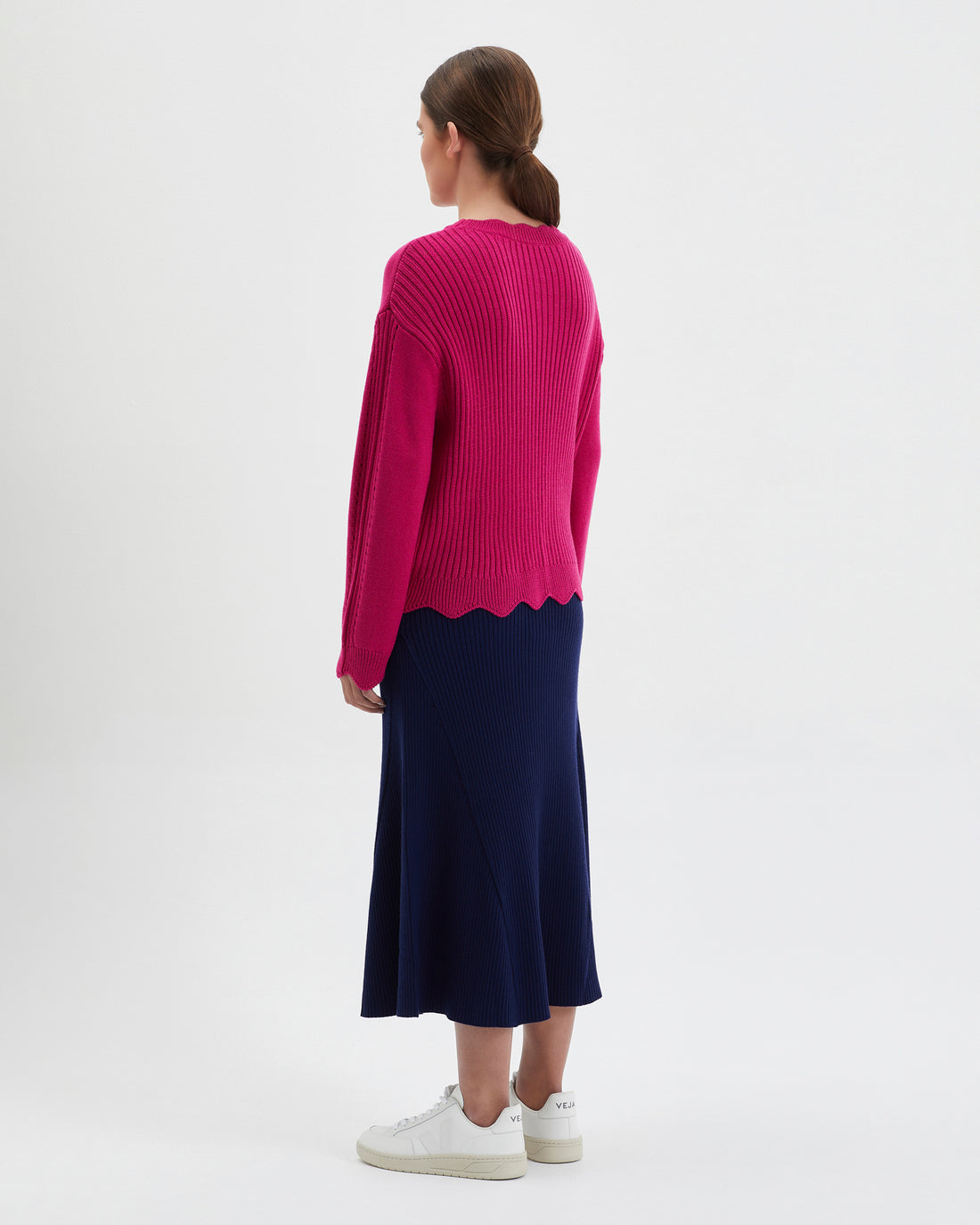 Cozy womens knit sweater in sage wool with stylish scalloped edges.
