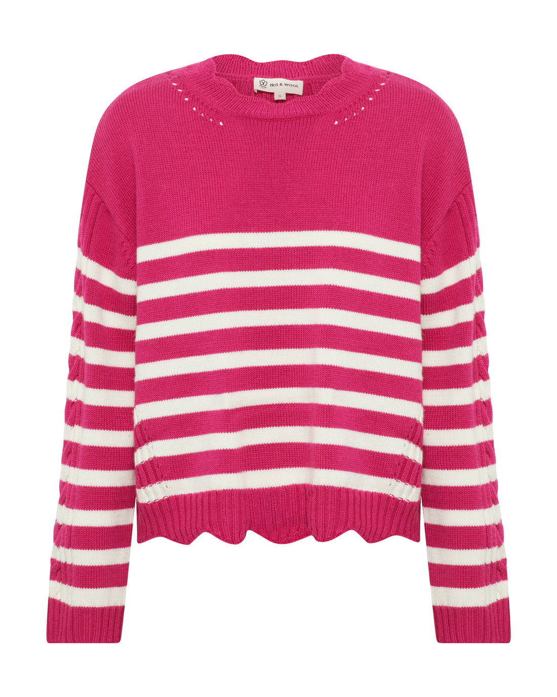 The front of a vibrant pink ribbed sweater with scalloped hem detailing.