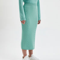 Wool skirt in sage with a soft, blanket-inspired design.