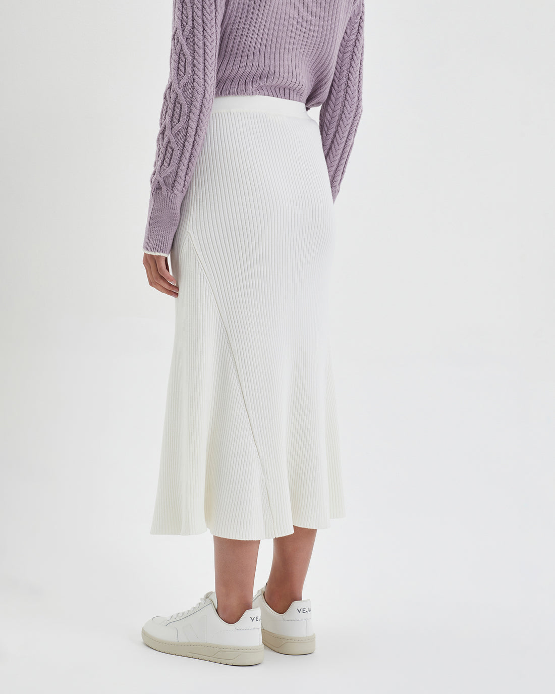 Classic ivory merino wool midi skirt with soft, luxurious texture.