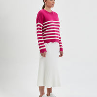 Cozy wool sweater in peony stripes, featuring scalloped details on neckline and cuffs.