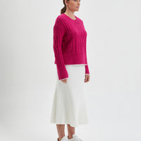 Elegant pink Burra crochet sweater in cozy Merino wool