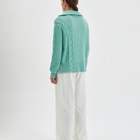 Relaxed-fit Nerida Sweater in sage, crafted from cozy Australian Merino wool.