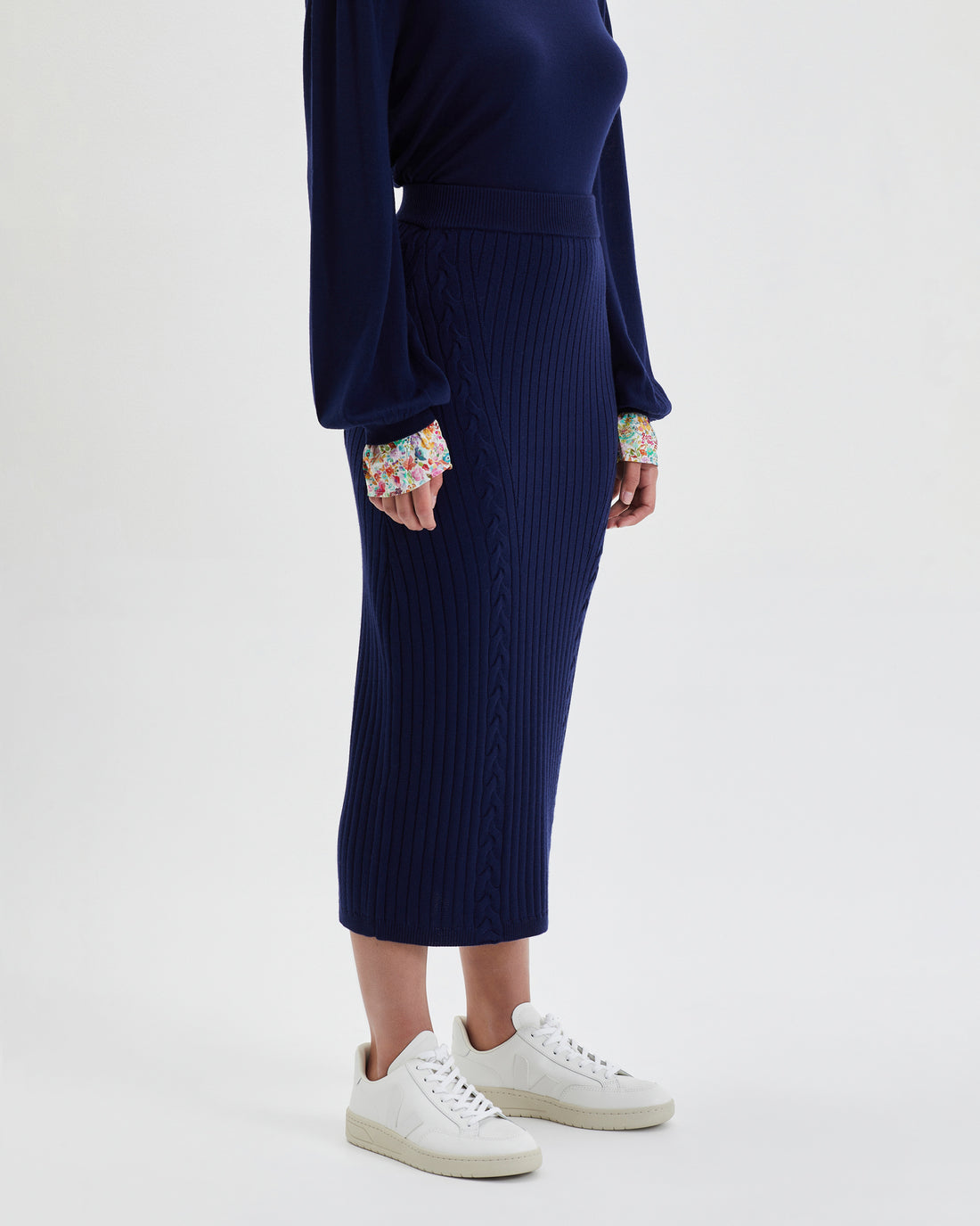 Elegant merino wool midi skirt in navy for versatile day-to-night wear.