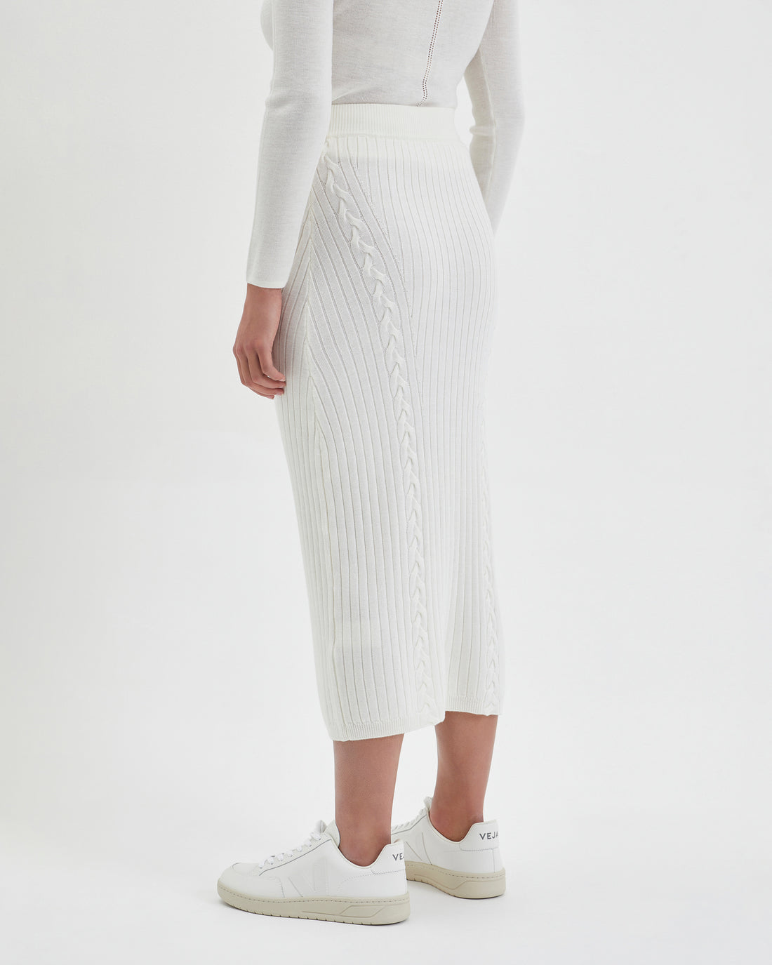 Elegant ivory merino wool midi skirt with blanket-like comfort.