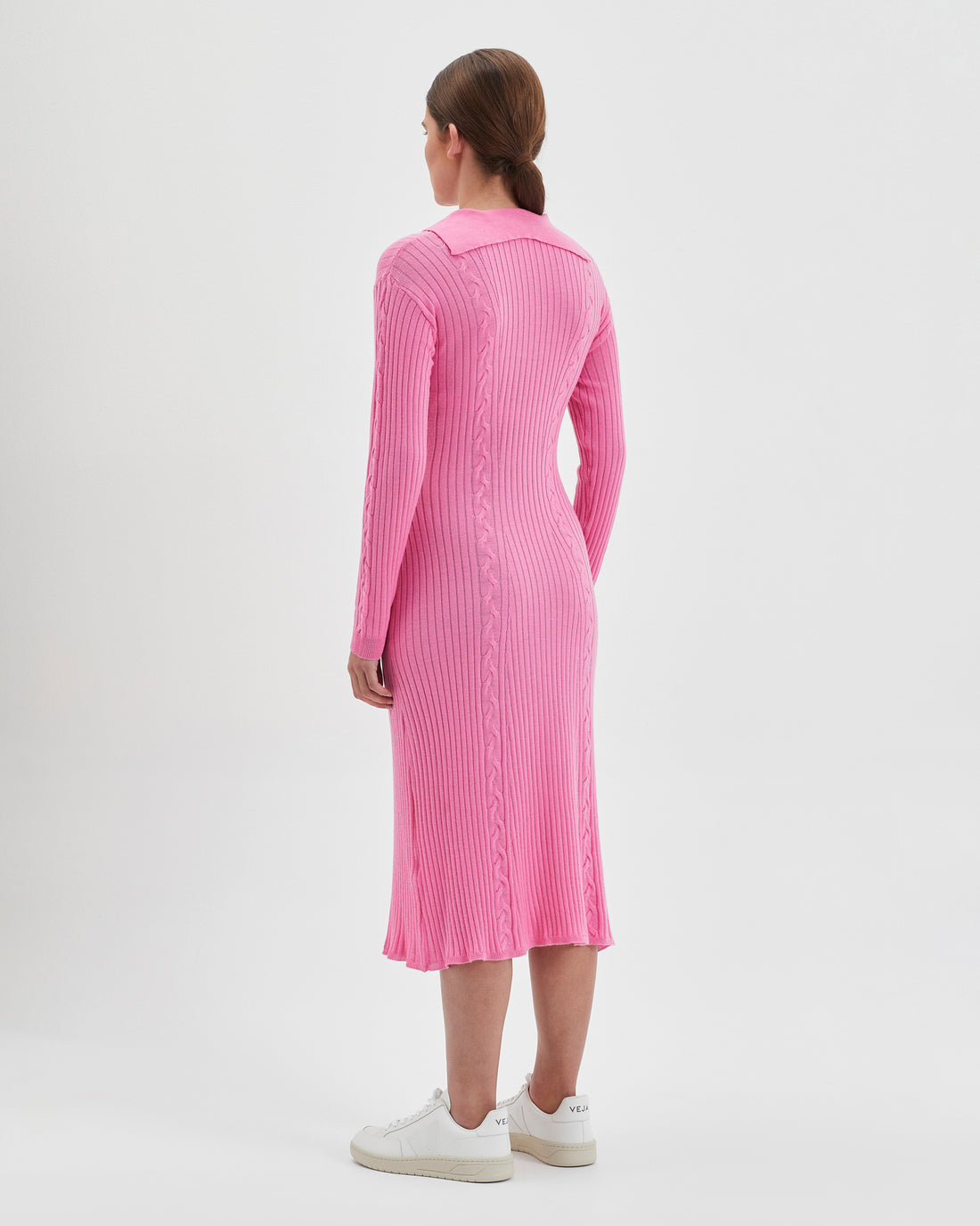 Pink merino wool dress with elegant lapel-style collar and cables.