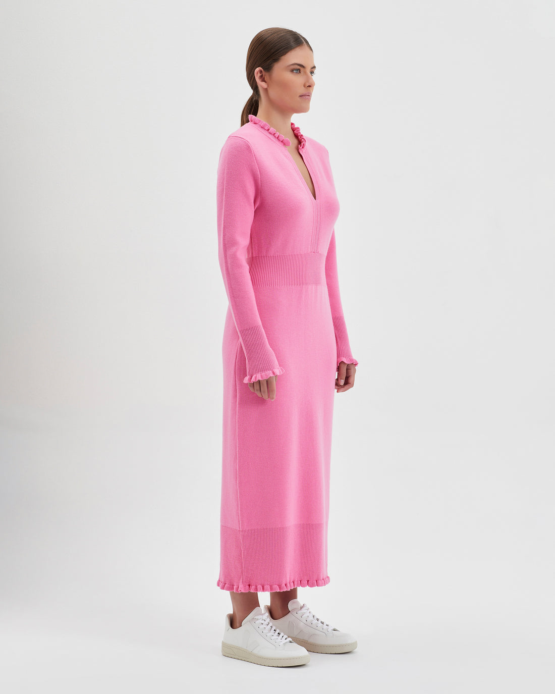 Romantic wool knit dress in candy with flattering waist and merino wool fabric.